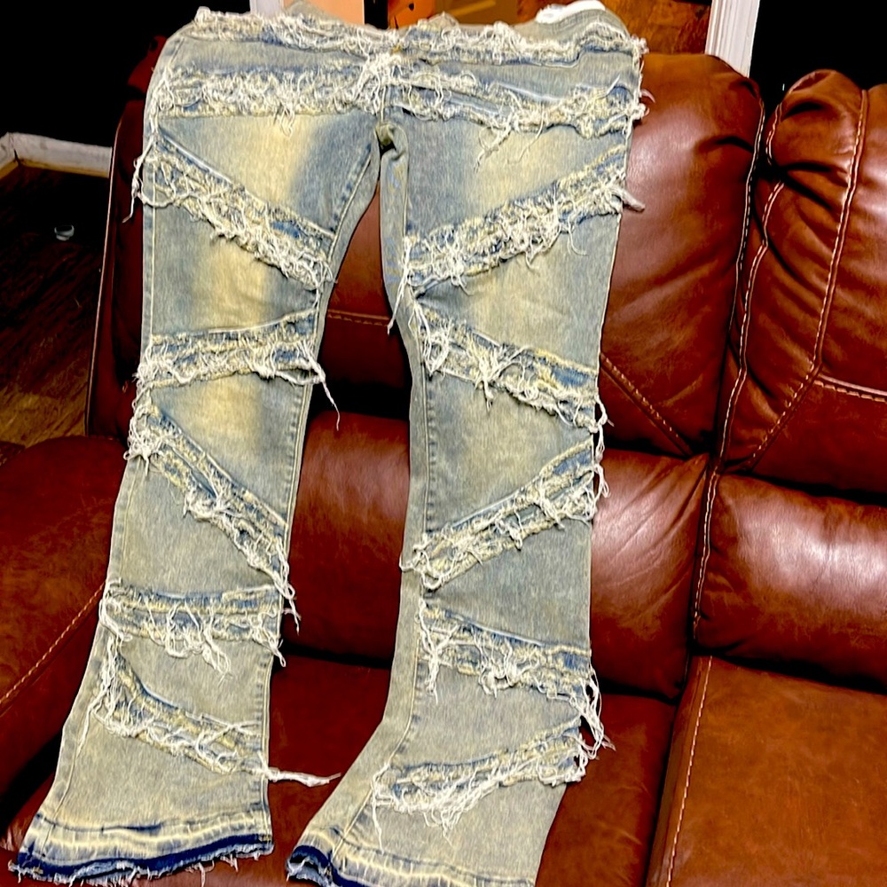 Men’s stacked, distressed jeans